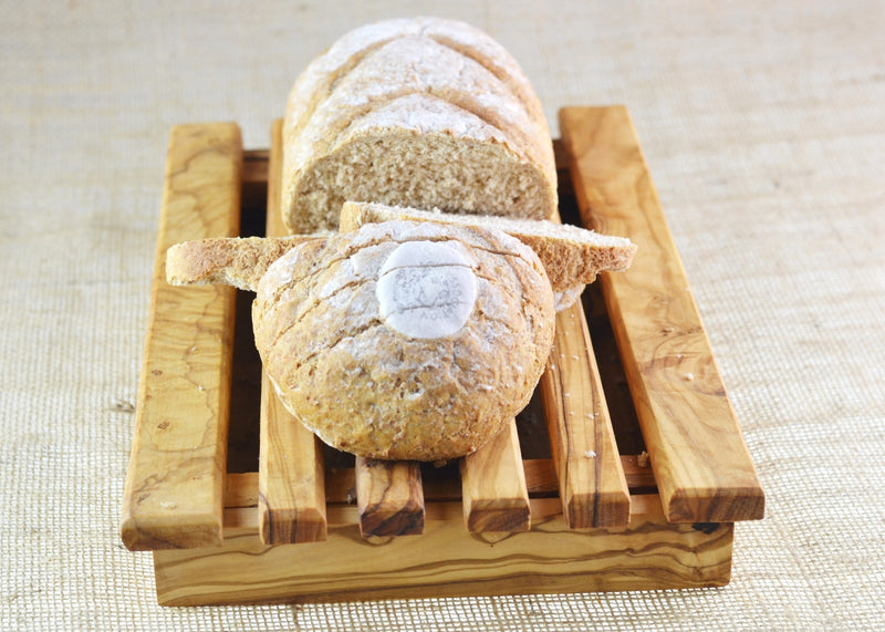 wooden olive wood bread board with bread on top planche a pain en bois d'olivier by MR OLIVEWOOD® Wholesale Supplier Manufacturer USA Canada